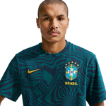 Person wearing a green soccer jersey with CBF and Nike logos on a white background