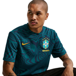 Person wearing a blue soccer jersey with CBF and 'Brasil' logos on a white background
