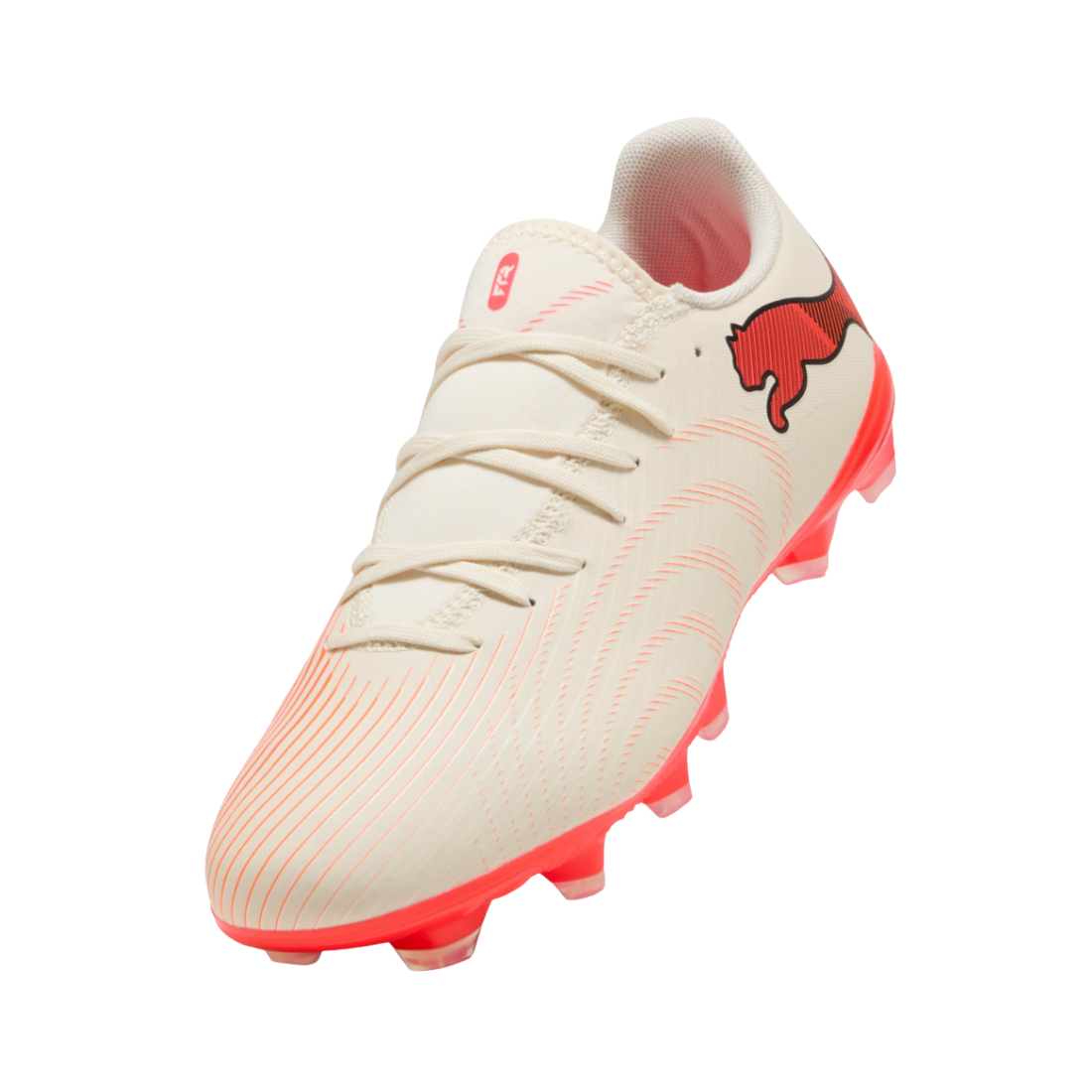 A Puma soccer cleat in off-white with vibrant pink accents, featuring a red Puma cat logo on the side and a pink outsole.