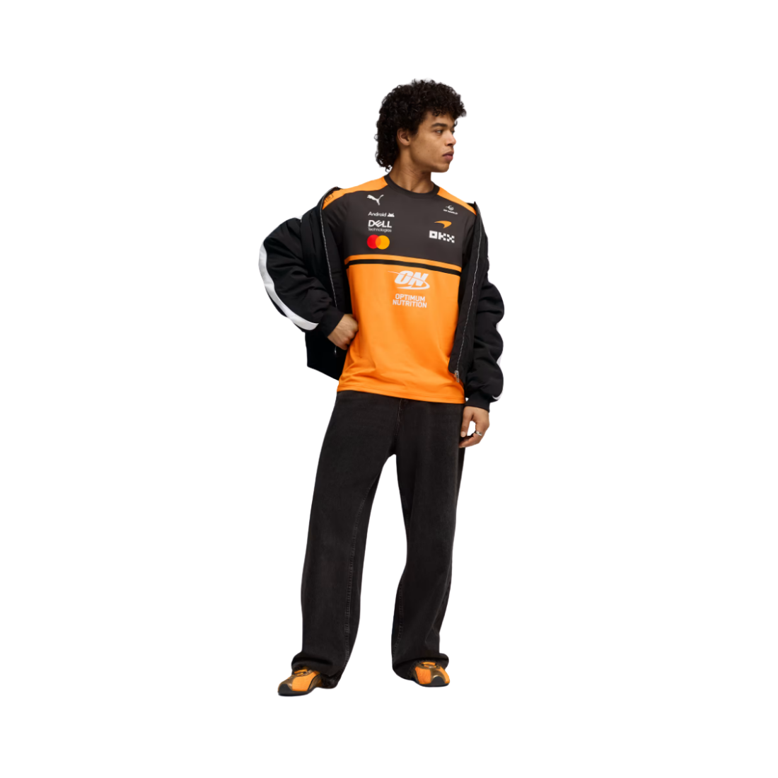 Man wearing PUMA McLaren replica jersey in orange and black with sponsor logos
