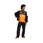 Man wearing PUMA McLaren replica jersey in orange and black with sponsor logos