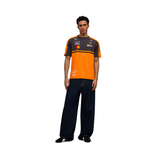 Man wearing orange and grey PUMA McLaren Piastri replica jersey with sponsor logos and driver signature