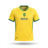 Yellow soccer jersey with green accents and 'BRAZIL' branding on a white background