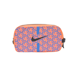 A Nike zippered pouch featuring a vibrant orange and blue geometric pattern with a black Swoosh logo on the front, set against a plain white background.