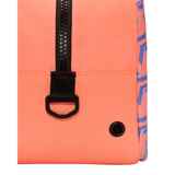 Close-up of a bright coral-orange backpack showing a black zipper with a black D-ring, a black rivet, and a side panel with a blue and white graphic pattern.