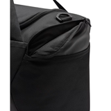 Close-up of a black duffel bag showing the open top zipper, interior lining, and a black D-ring on a white background.
