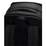 Close-up of a black backpack showing the top zipper compartment, padded shoulder strap, and textured fabric material.