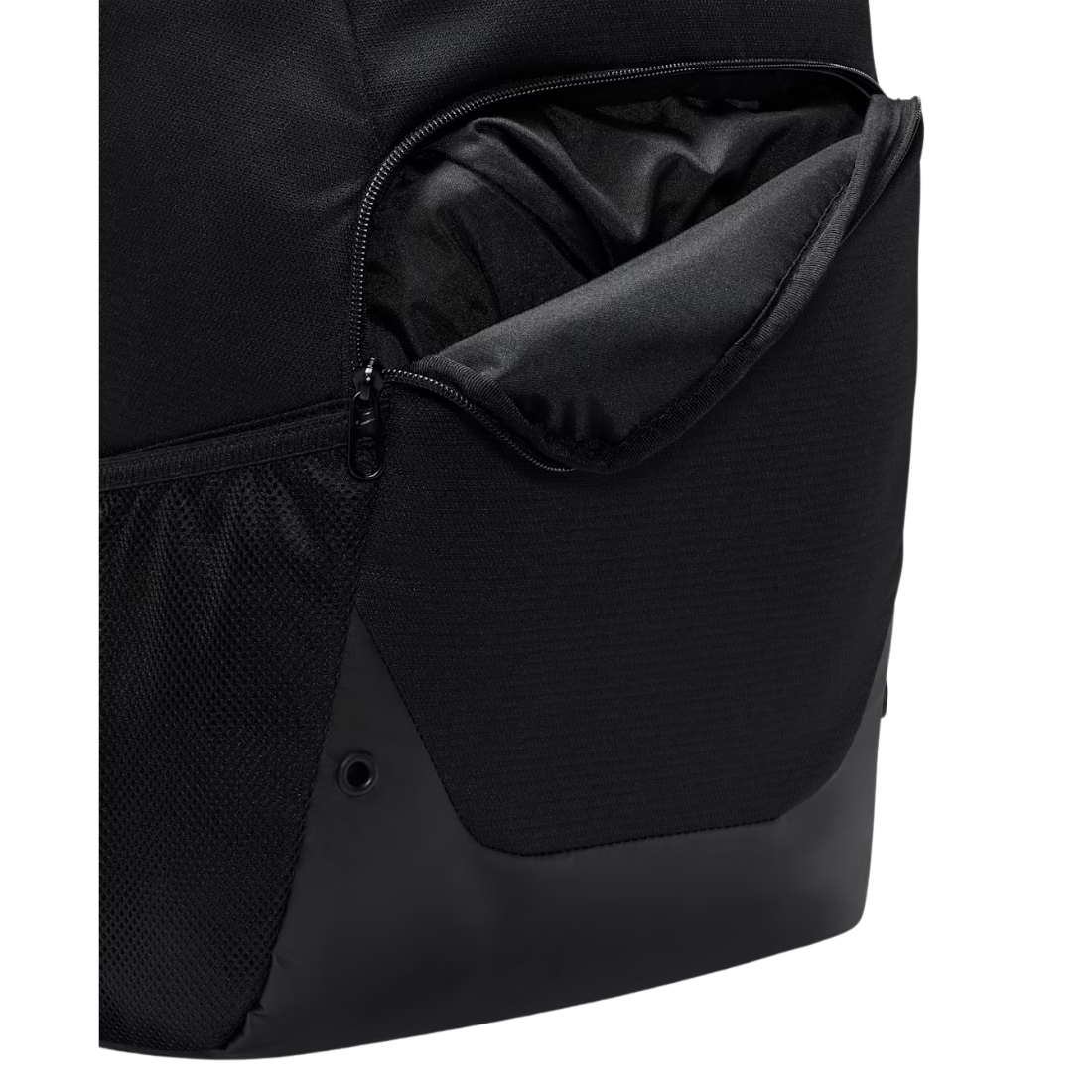 Close-up of a black backpack showing a zippered pocket with a black interior lining and a black mesh side pocket against a white background.