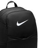 A close-up of a black Nike backpack showing the front pocket with a white Nike swoosh logo, set against a plain white background.