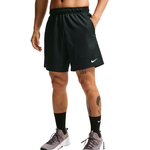 A person wearing black Nike athletic shorts, black crew socks, and gray running shoes against a plain white studio background.