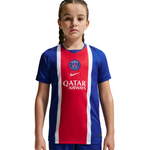 Child wearing a red, white, and blue sports jersey with a logo on a white background