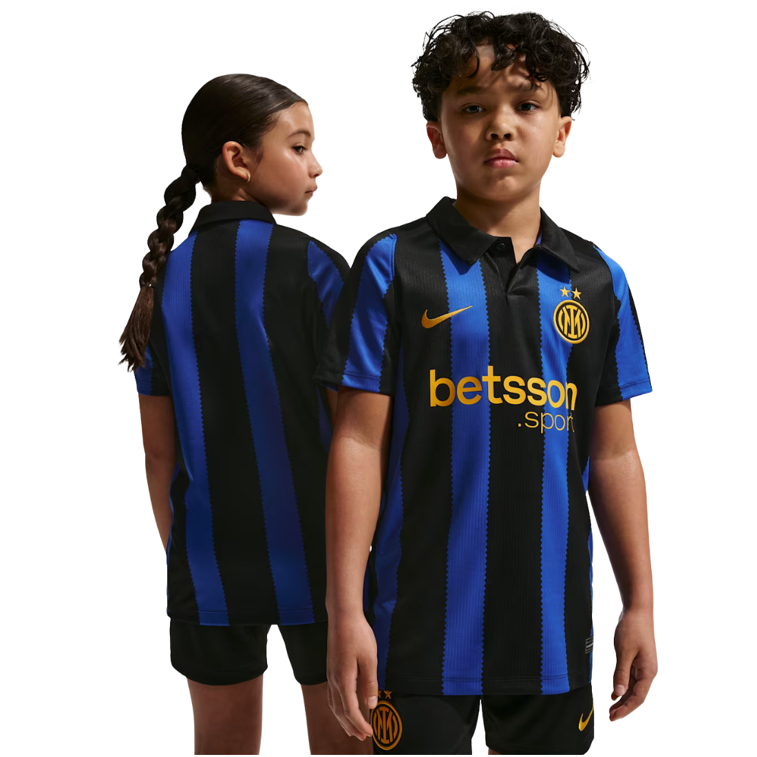 Two children modeling a black and blue vertically striped Inter Milan soccer jersey with a yellow Nike swoosh and Betsson sponsor logo, shown against a plain white background.
