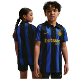 Two children modeling a black and blue vertically striped Inter Milan soccer jersey with a yellow Nike swoosh and Betsson sponsor logo, shown against a plain white background.