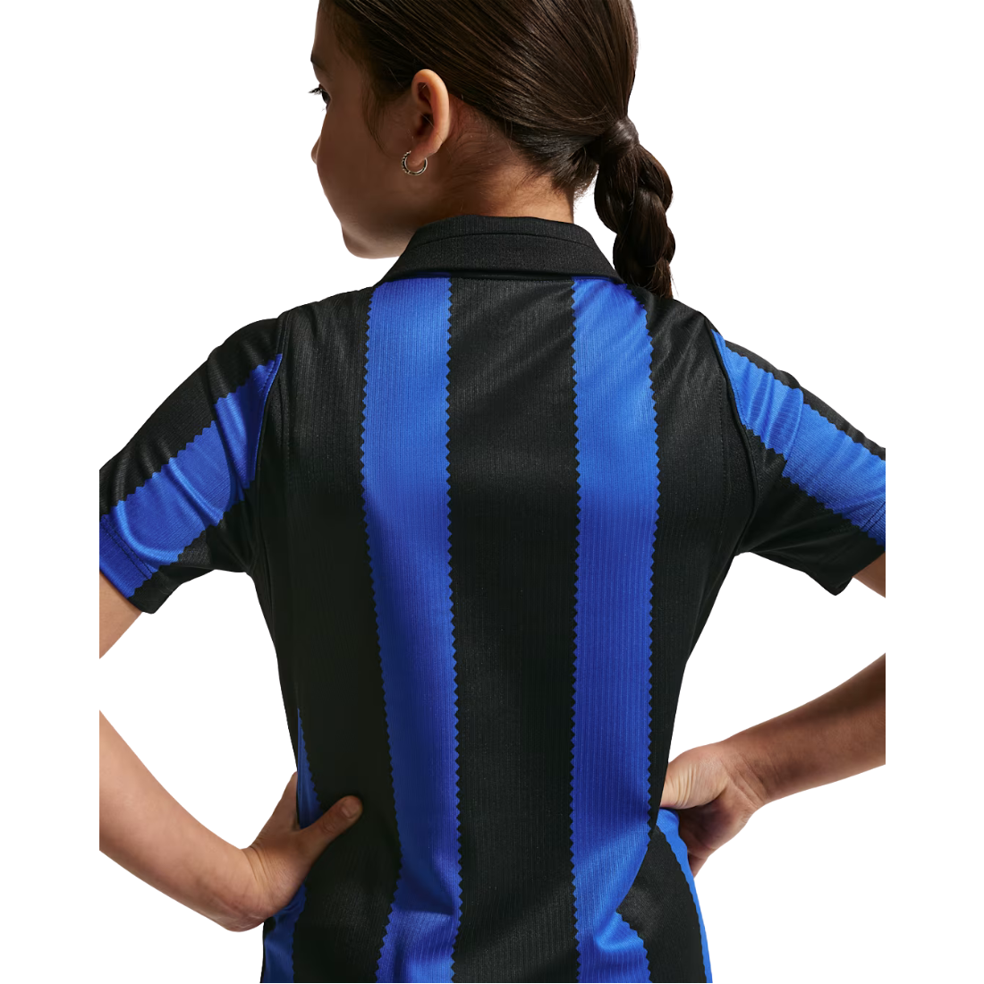 A child wearing a short-sleeve soccer jersey, shown from the back. The jersey features bold vertical black and royal blue stripes, with the child's hands on their hips against a plain white background.