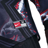 Close-up of a Nike jacket with a brand label on a white background