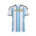 Argentina national football team home jersey by Adidas, featuring light blue and white vertical stripes with black shoulder stripes, the Adidas logo, the AFA crest, and a FIFA patch on the chest.