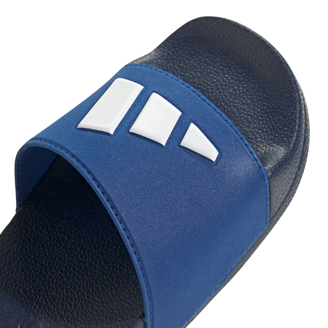 Blue slide sandal with white stripes on a light gray background