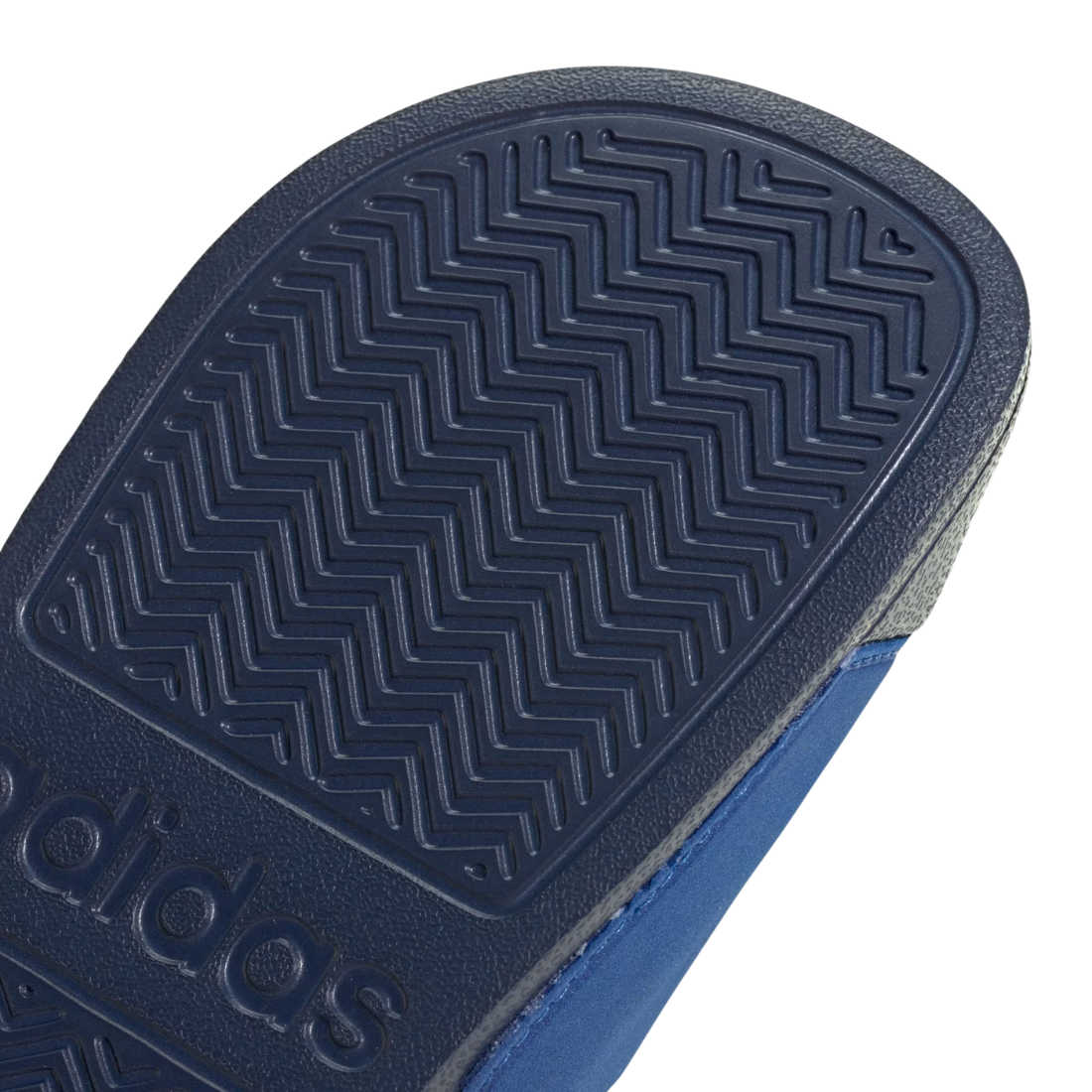 Close-up of a textured black sole on a light gray background