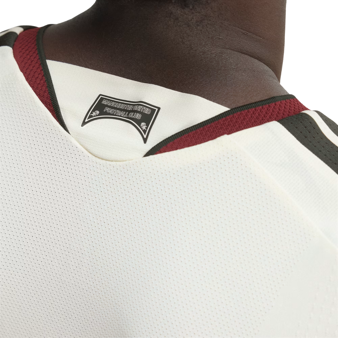 Close-up of the back neck of a white mesh sports jersey with burgundy and black trim, featuring a black 'Pittsburgh Panthers' team patch.
