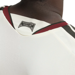 Close-up of the back neck of a white mesh sports jersey with burgundy and black trim, featuring a black 'Pittsburgh Panthers' team patch.