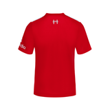 A red short-sleeve athletic jersey shown from the back, featuring a white crest logo centered on the upper back and white text on the left sleeve, displayed against a solid white background.